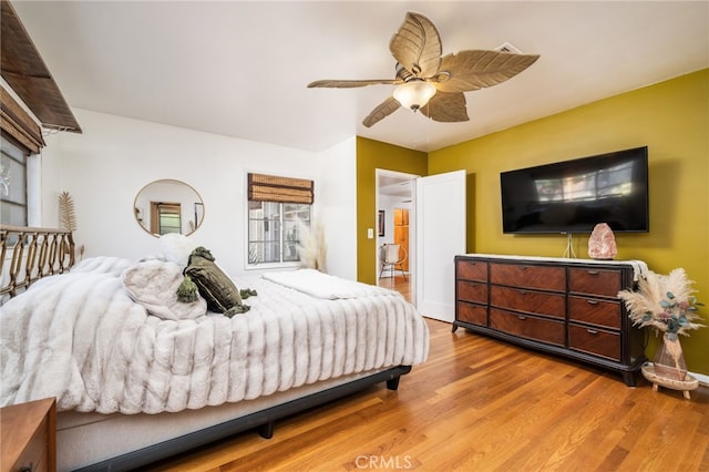 bedroom with ceiling fan and wood finished floors