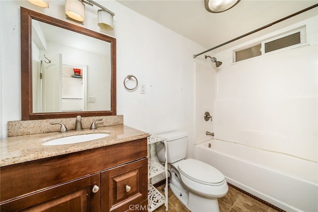 bathroom featuring vanity, toilet, and shower / bathtub combination