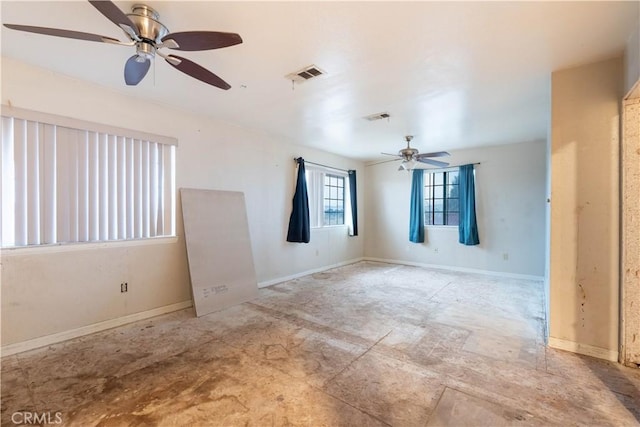 empty room featuring visible vents and baseboards