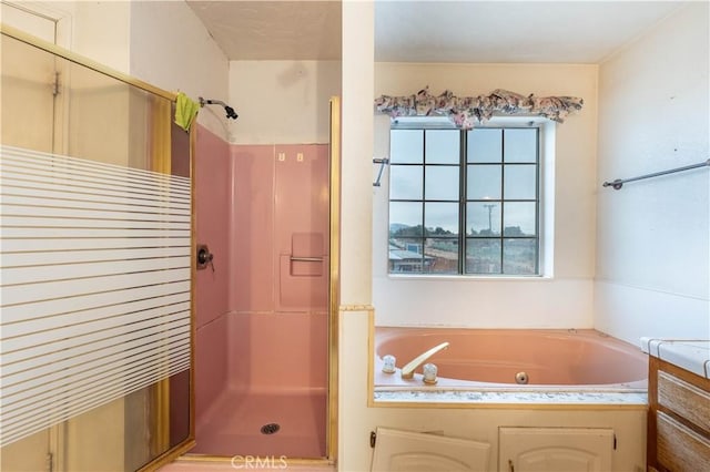 full bathroom featuring a stall shower and a jetted tub