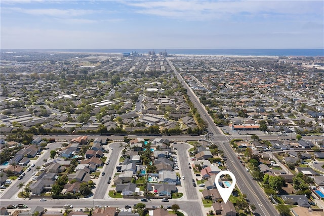 bird's eye view featuring a water view and a residential view