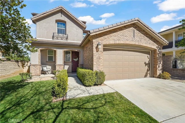 view of front of home with an attached garage, covered porch, driveway, stucco siding, and a front lawn