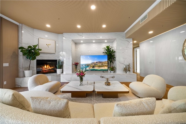 interior space featuring a high end fireplace and recessed lighting