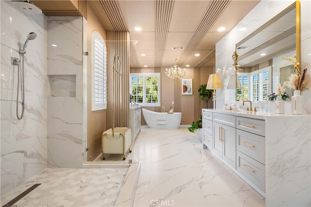 bathroom featuring a freestanding tub, recessed lighting, vanity, marble finish floor, and a marble finish shower