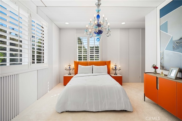 bedroom with a notable chandelier, recessed lighting, and light colored carpet