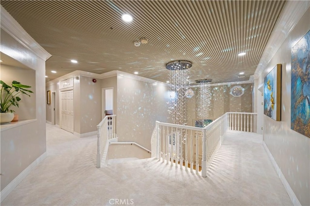 hall featuring baseboards, ornamental molding, an upstairs landing, carpet floors, and recessed lighting