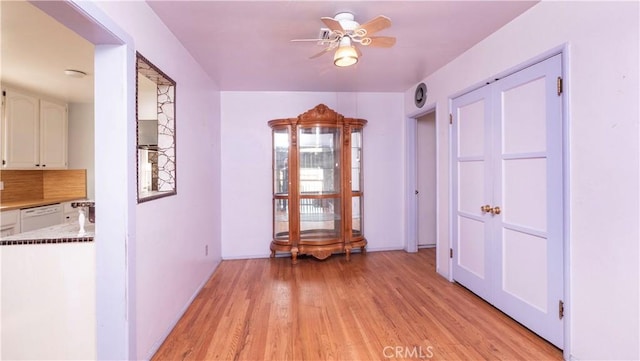 unfurnished room featuring ceiling fan and light wood-type flooring