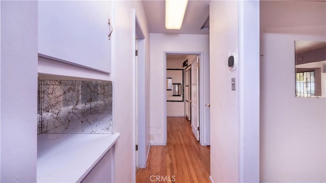 corridor featuring light wood-style floors