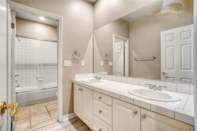 26803 Brookhollow Dr, Valencia, CA 91355 - bathroom featuring double vanity, toilet, shower / bathtub combination, and baseboards