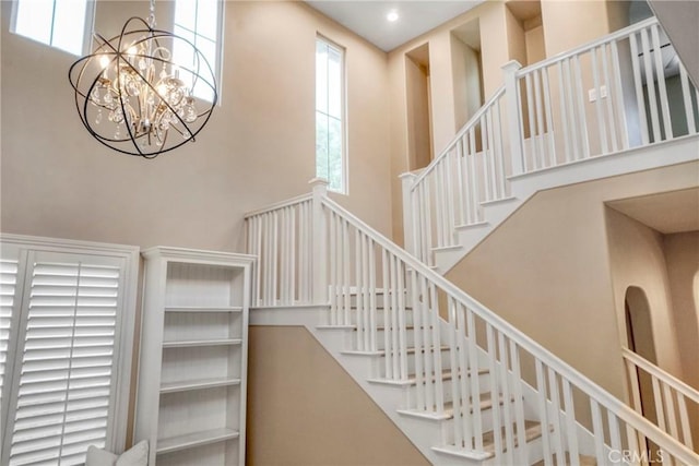 26803 Brookhollow Dr, Valencia, CA 91355 - stairs featuring a towering ceiling, a chandelier, and recessed lighting