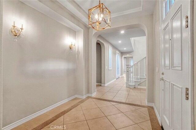 26803 Brookhollow Dr, Valencia, CA 91355 - corridor featuring arched walkways, light tile patterned floors, a chandelier, stairs, and baseboards
