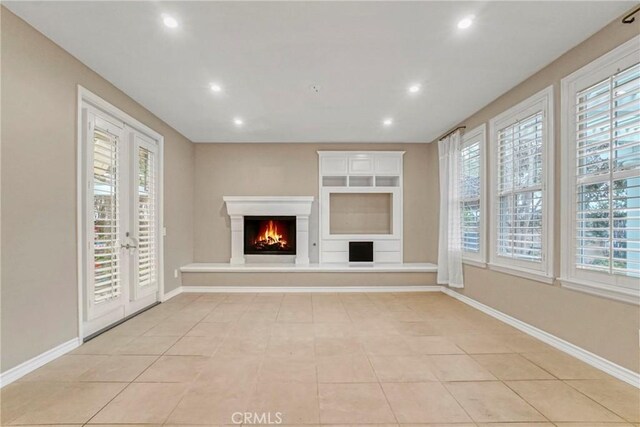 26803 Brookhollow Dr, Valencia, CA 91355 - unfurnished living room featuring recessed lighting, a warm lit fireplace, light tile patterned flooring, and baseboards
