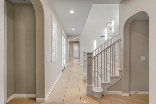 26803 Brookhollow Dr, Valencia, CA 91355 - hall with arched walkways, tile patterned floors, baseboards, stairs, and recessed lighting