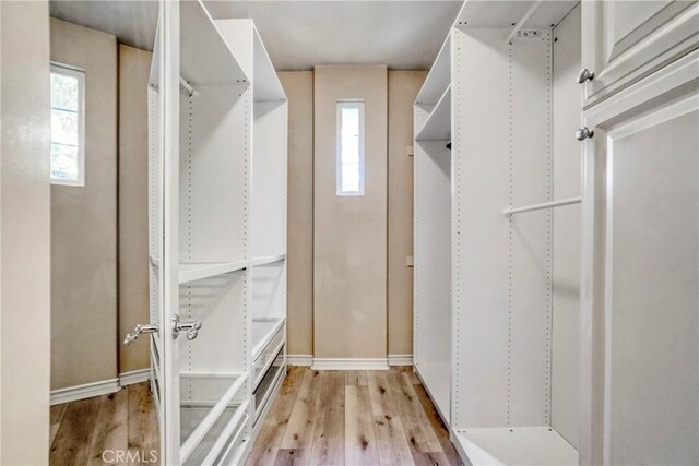 26803 Brookhollow Dr, Valencia, CA 91355 - spacious closet with light wood finished floors