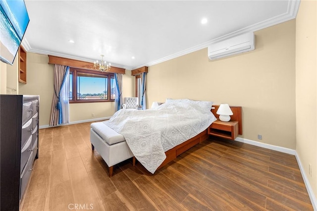 bedroom with ornamental molding, a wall unit AC, baseboards, and wood finished floors