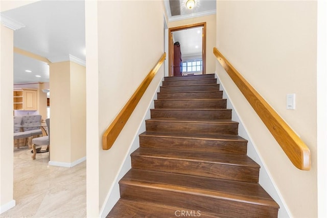 stairway featuring baseboards, ornamental molding, and recessed lighting