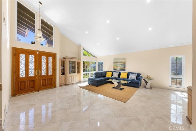 foyer with high vaulted ceiling, recessed lighting, marble finish floor, and ornamental molding