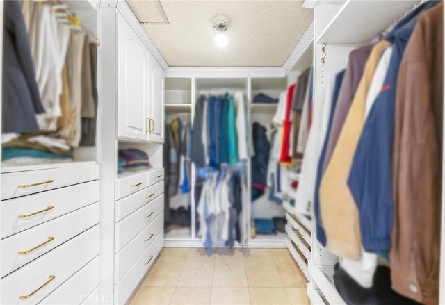 spacious closet featuring light tile patterned floors