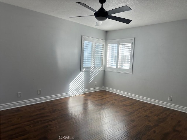 unfurnished room featuring ceiling fan, a textured ceiling, wood finished floors, and baseboards