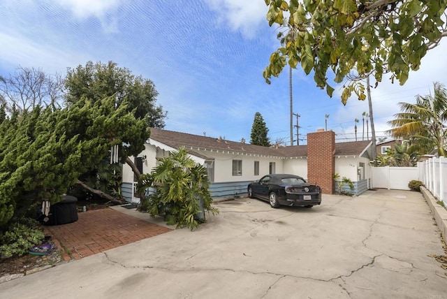 view of front of property with fence and stucco siding