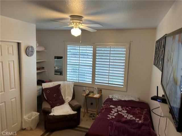 interior space with ceiling fan