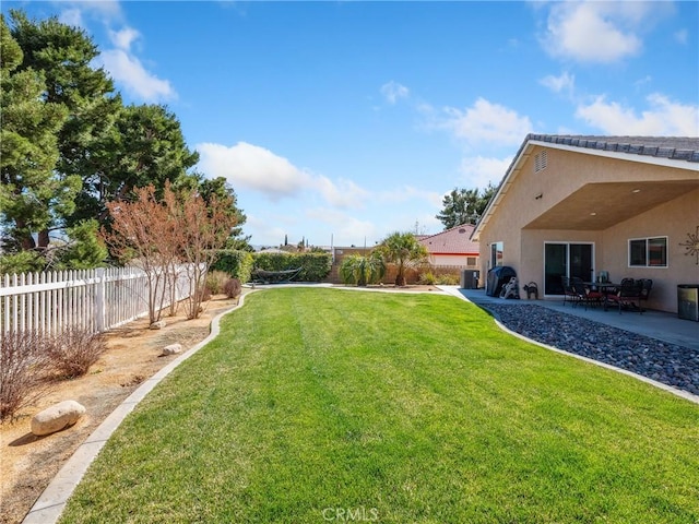 view of yard with a patio area and a fenced backyard