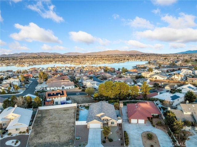 aerial view with a residential view and a water and mountain view