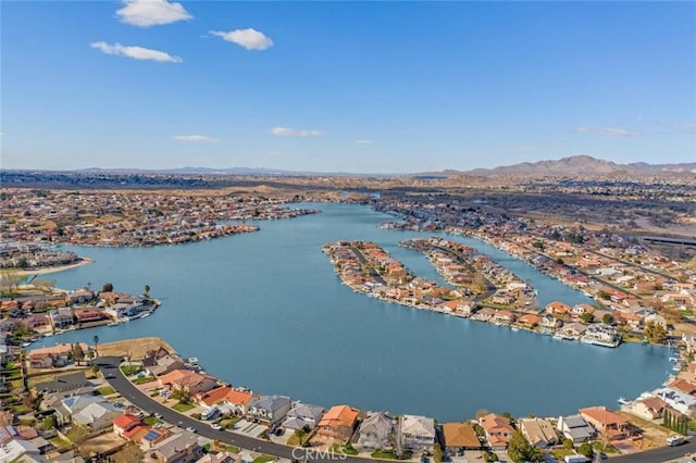 drone / aerial view with a residential view and a water and mountain view