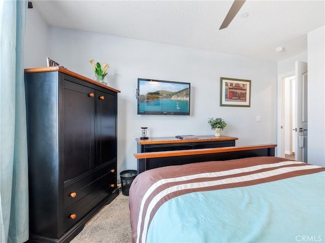 bedroom with carpet and a ceiling fan