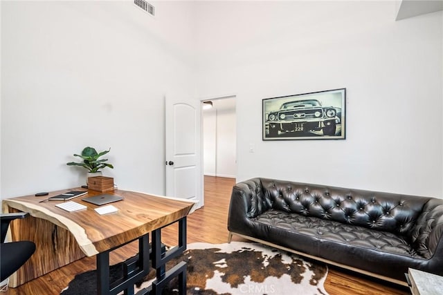 office featuring visible vents and wood finished floors