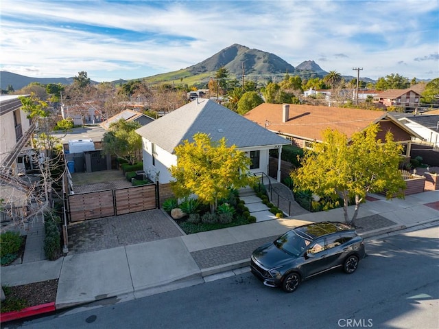 birds eye view of property with a residential view and a mountain view