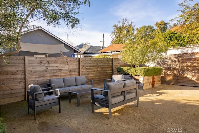 view of patio with outdoor lounge area and a fenced backyard