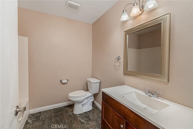 full bath featuring visible vents, vanity, toilet, and baseboards