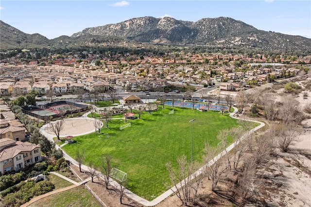 drone / aerial view featuring a residential view and a mountain view