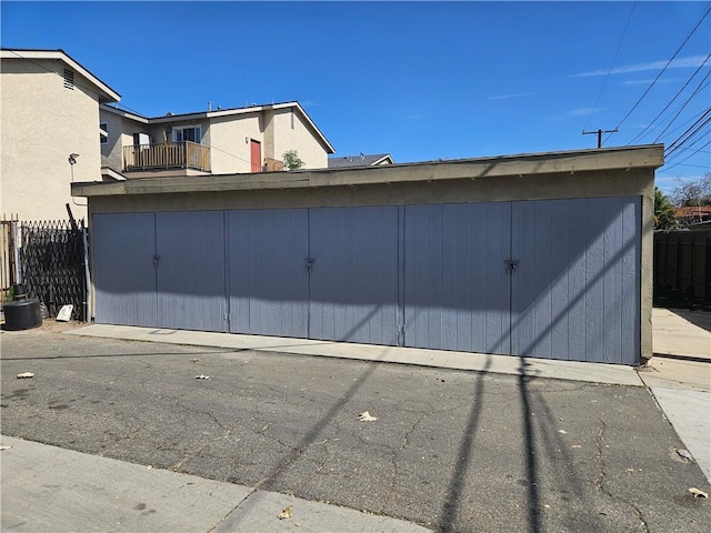 garage featuring fence