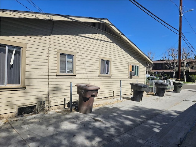 view of side of property with fence