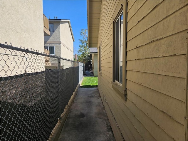 view of home's exterior featuring fence