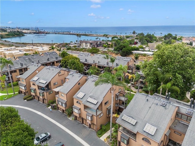 birds eye view of property featuring a water view and a residential view