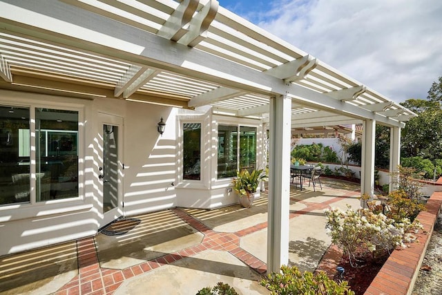 view of patio / terrace featuring outdoor dining area and a pergola