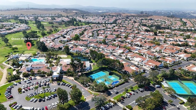 birds eye view of property with a residential view