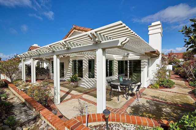 view of patio featuring a pergola and outdoor dining space