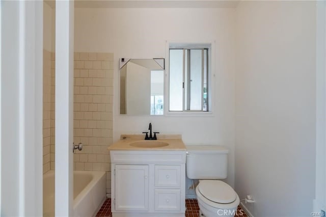 bathroom featuring bathtub / shower combination, vanity, and toilet