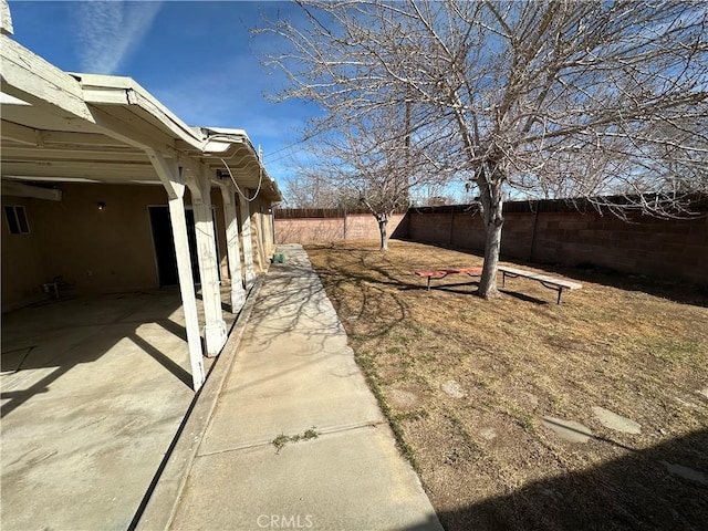 view of yard with a fenced backyard