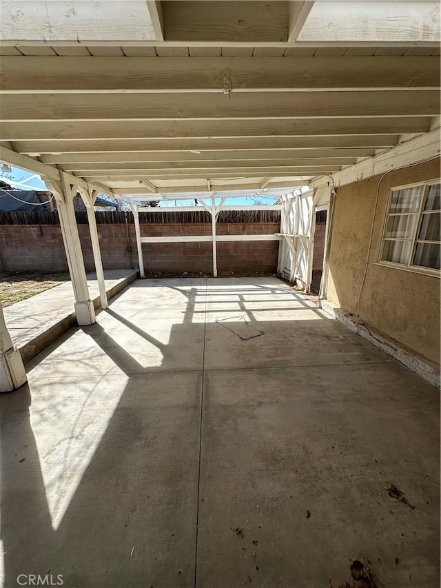 view of patio / terrace featuring fence