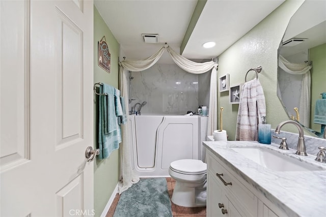 full bathroom with a tub, visible vents, toilet, and vanity