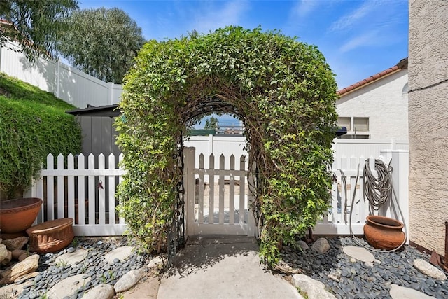 view of gate with fence