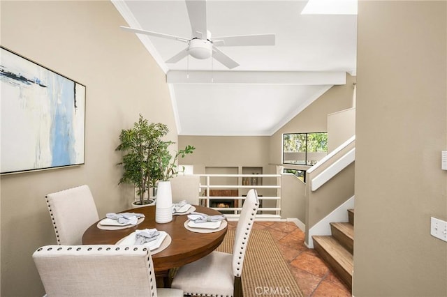 dining area featuring crown molding, stairway, vaulted ceiling, and a ceiling fan