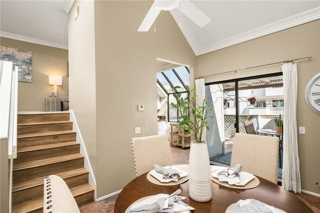 dining area featuring lofted ceiling, stairs, a ceiling fan, and crown molding