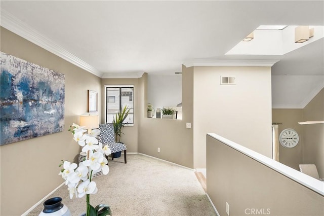 living area with carpet floors, visible vents, an upstairs landing, baseboards, and ornamental molding