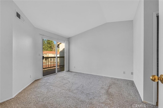 carpeted empty room featuring vaulted ceiling, visible vents, and baseboards